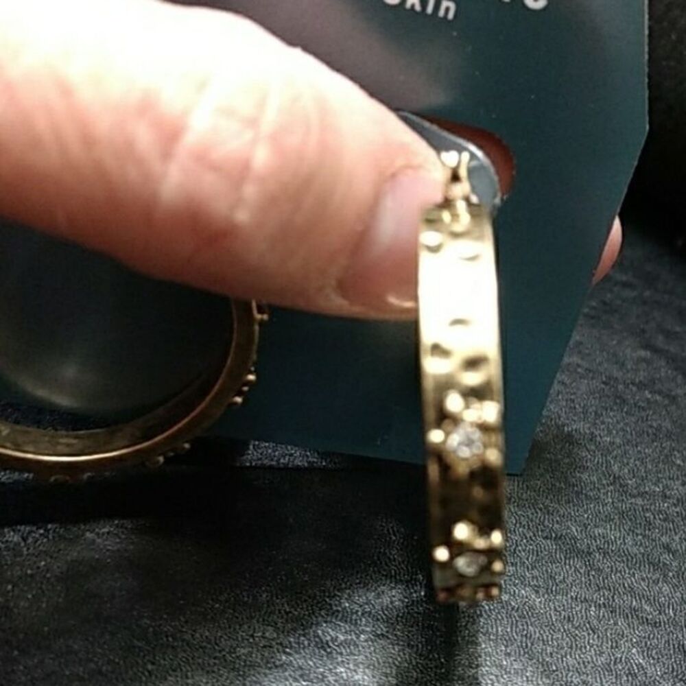 Gold tone rhinestone textured hoop earrings